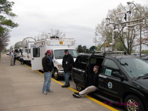 Mobile mesonet, field command vehicle, and radar trucks parked outside the OKC Science Museum.